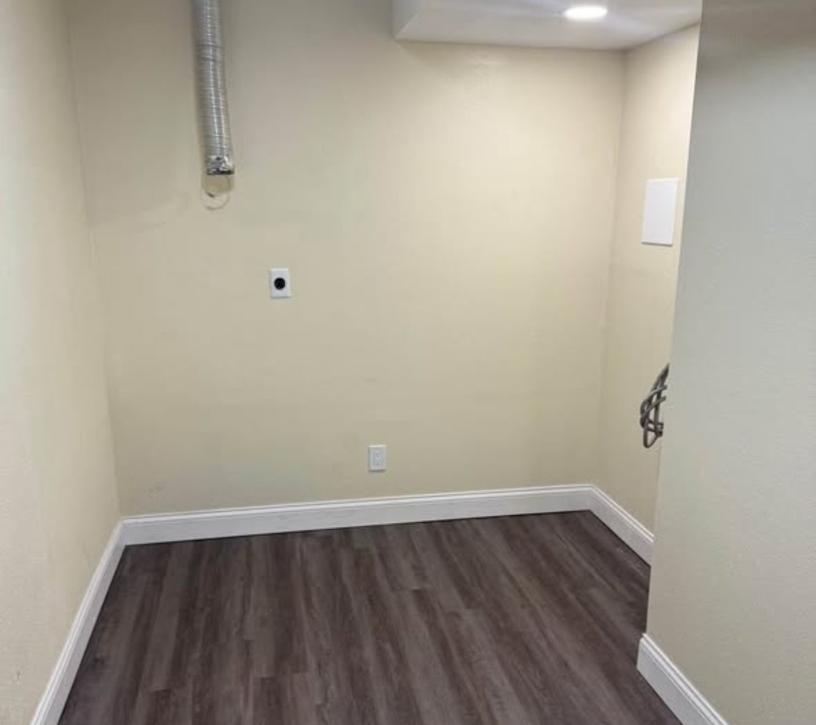 Laundry nook with washer dryer hookups at 1702 W Olive St